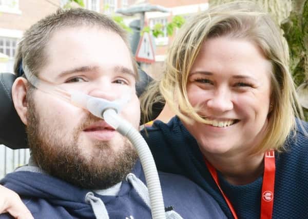 Rachael Moses, consultant physiotherapist at Lancashire Teaching Hospitals, with her patient Ben Styles, who has Duchenne muscular dystrophy
