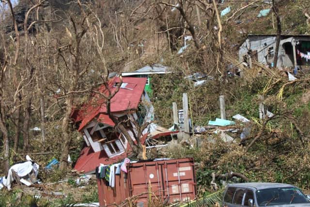 Homes lay scattered after the passing of Hurricane Maria in Roseau, the capital of the island of Dominica