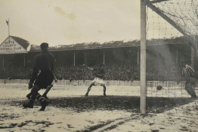 Higham (centre) scoring a goal for Nottingham Forest  while wearing a boxing glove