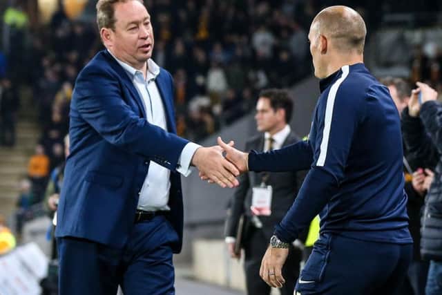 Alex Neil shakes hands with Hull head coach Leonid Slutsky