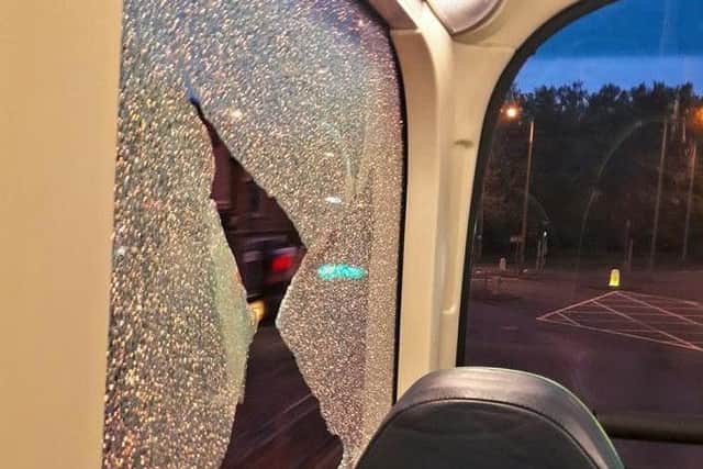 The window of the bus was smashed. Pic: Nicola Martin