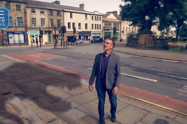 David Chandler encounters a dinosaur on the streets of Lancaster