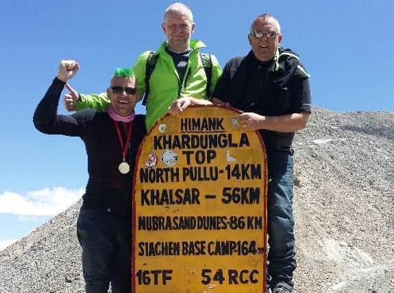 Left to right Nigel Ralphson, Brian Mills-Woods and Robert Hodgson at the top of the Khardung La Pass.