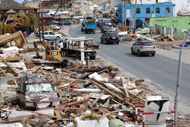 Trying to clear the roads in St Maarten, which was flattened by Hurricane Irma