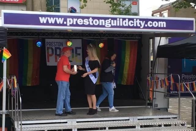Jessica presenting LGBT campaigner John Miller his lifetime achievement award at Preston Pride 2017