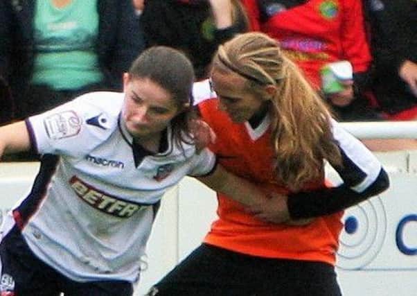 Chorley's Saskia Bowes battles with a Bolton forward