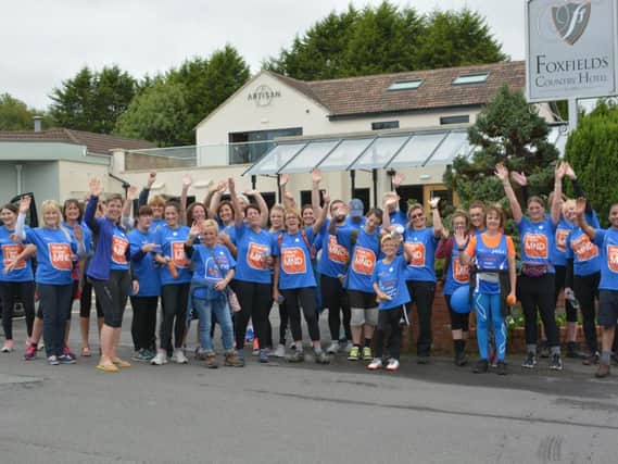 Julie Sala, MND nurse specialist from the MND Care and Research Centre at Royal Preston Hospital, along with her colleagues and ELHT Colne district nurses, completed a 30-mile walk from the city hospital to Colne Health Centre.