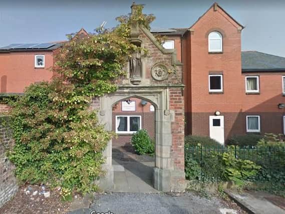 A man and a woman were treated for smoke inhalation following a kitchen fire at a block of flats in Preston