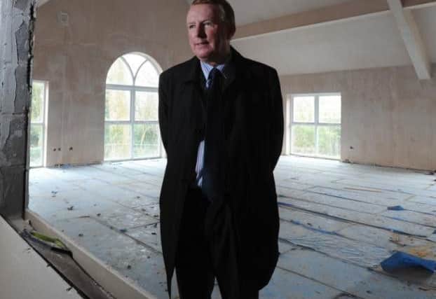 Coun Peter Gibson pictured at St Thomas's new hall after 'offering' 150,000 of council funds towards the project
