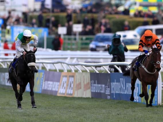Many Clouds (left) beating Thistlecrack in his final race at Cheltenham