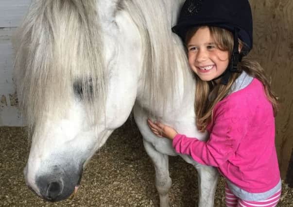 Isabella Dawson with her rescue pony Norman