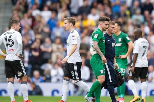 Sean Maguire goes off injured against Fulham