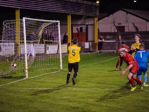 Adam Dodd puts Brig two goals up.                      PHOTO: Ruth Hornby