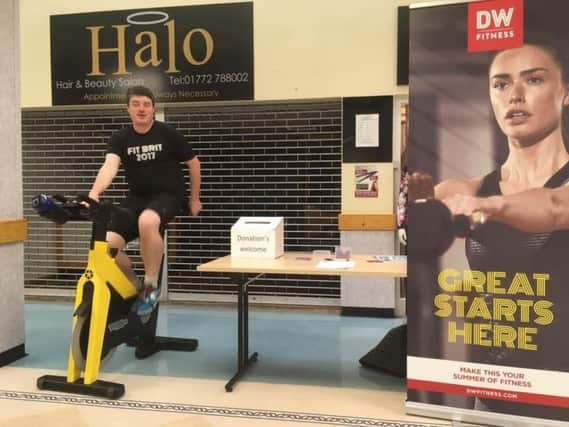Peter Tassiker, assistant manager of DW Sports and Fitness, Portway, Preston, rode a spin bike for eight hours, at Royal Preston Hospital foyer.