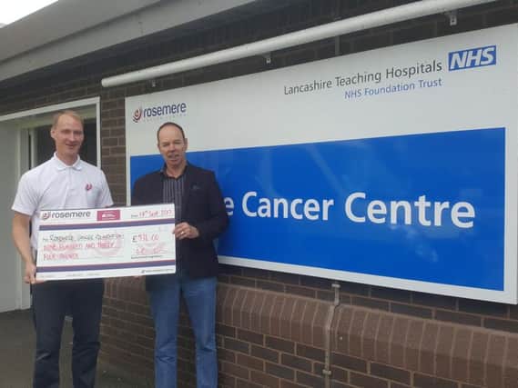 Denis Ashcroft presents a cheque to Rosemere Cancer Foundation