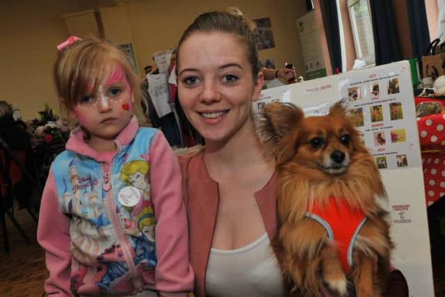Annamaria Matsumura with Alex, four, left, and dog Aiko, right