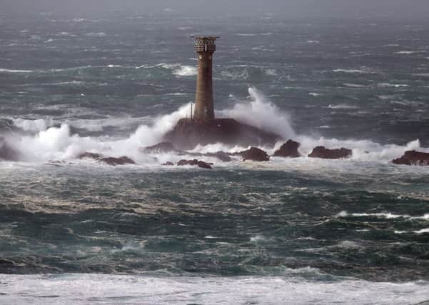 Waves crash around the Longships lighthouse off of Land's End in Cornwall, as Storm Brian hits the UK with winds of up to 70mph battering coastal areas. PRESS ASSOCIATION Photo. Picture date: Saturday October 21, 2017. See PA story WEATHER Brian. Photo credit should read: Andrew Matthews/PA Wire