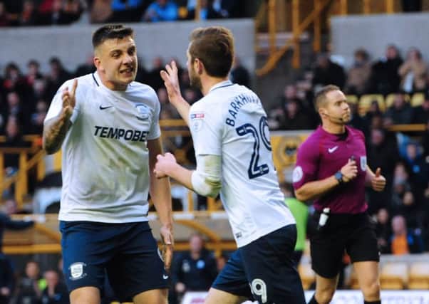 Preston North End's Tom Barkhuizen, right, celebrates after forcing an own goal from Coady with team-mate Jordan Hugill