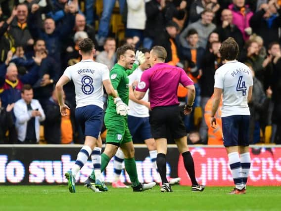 PNE goalkeeper Chris Maxwell protests to referee Stephen Martin after Wolves' third goal