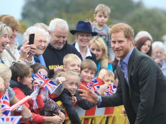 Prince Harry meets well wishers as he arrives for his visit to the village hall at St Michaels on Wyre