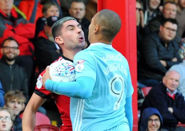 Brentfords Neal Maupay (left) goes chest-to-chest with Sunderland striker James Vaughan (photo: Frank Reid)
