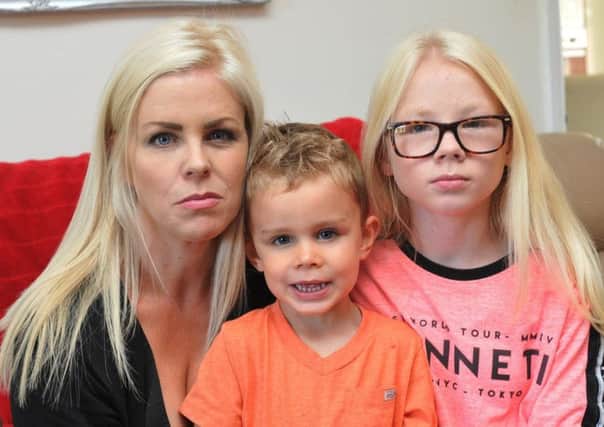 Gemma Hammond with Connah, three, and Imogen, ten, who were scammed by a modeling agency
