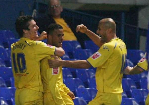 Simon Whaley is congratulated by David Nugent and Danny Dichio after scoring Preston's winner at Ipswich