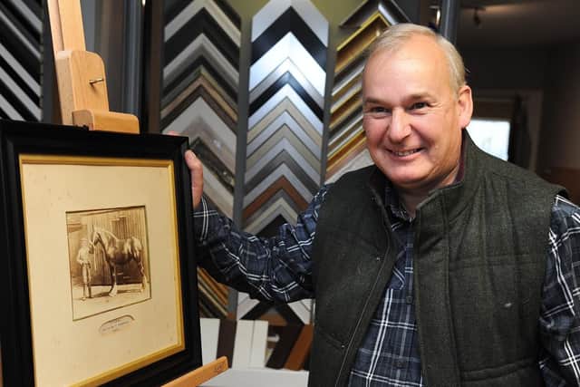 Reunited Frame Family reunited with heirloom hidden in mirror frame for years