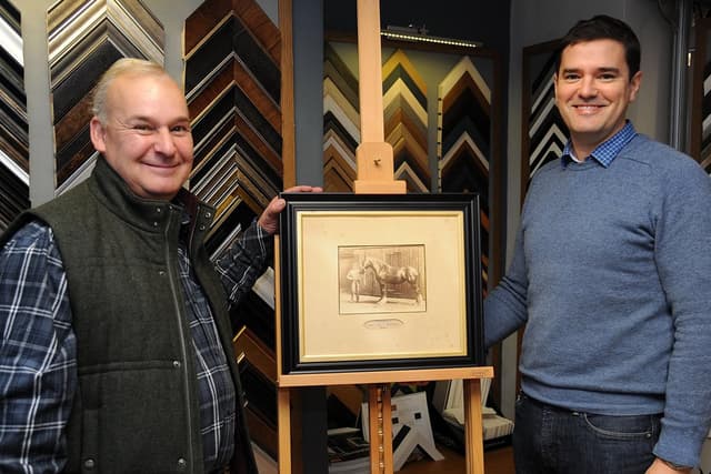 Reunited Frame Family reunited with heirloom hidden in mirror frame for years