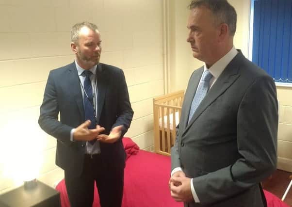 Commissioner Clive Grunshaw talking to Detective Chief Inspector Mark Vaughton from Lancashire Constabulary at the modern slavery victims suite.