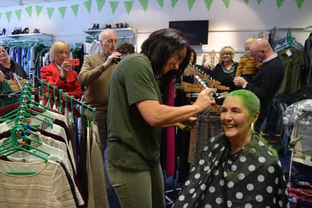 Jane Cooper having her head shaved for St Catherine's Hospice