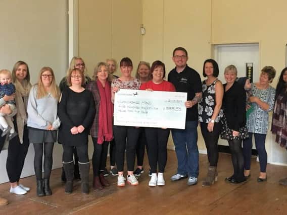 Plungington Slimming World members have been placing the 5p change they receive from the weekly fee into collection tins for the last 12 months to raise 555.55 for Lancashire Mind