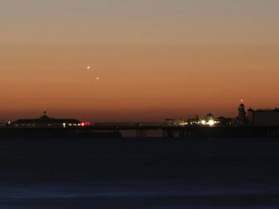 Venus (left) and Jupiter in the skies over Brighton Pier