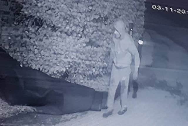 CCTV image of suspect after artificial grass stolen in Adlington