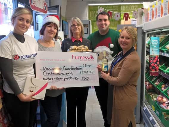 Cathy Skidmore (far right), together with Rosemere Cancer Foundations central area fundraising co-ordinator Becca Hall (far left) receives Rosemere Cancer Foundations Co-op Local Community Fund donation from Ripon Street store staff, left to right, Julie Holmes, Christine Lang and Martin Butcher