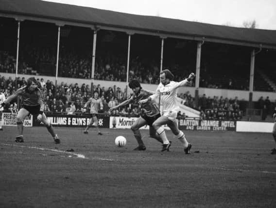 PNE striker Paul McGee on the attack against QPR in 1980