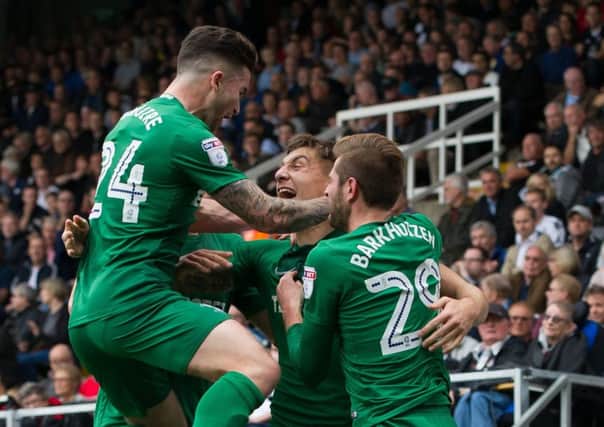 Jordan Hugill is congratulated on his goal at Fulham.