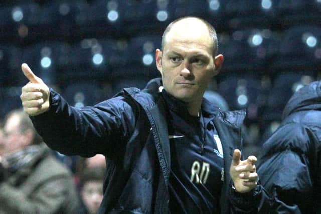 Alex Neil salutes the fans after his Preston side got over the line against QPR.