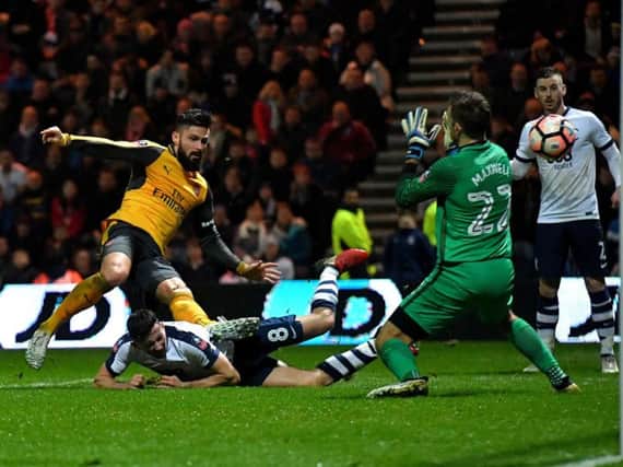 Arsenal's Olivier Giroud fires a late winner past Chris Maxwell during last year's third round clash at Deepdale.