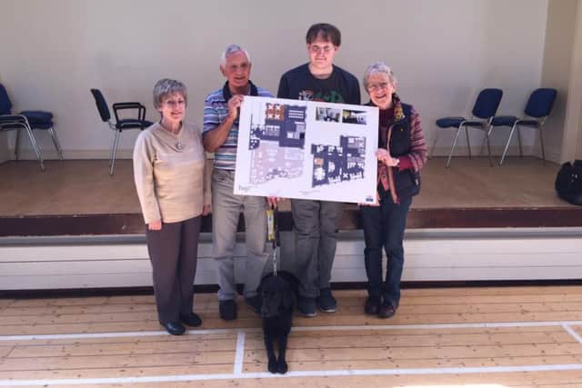 Members of the Galloway's consultation group with plans for the Victoria Street Building: David Liddell; Julia Chabrol ; Kay Saunders and Tony Kimpton with his guide dog, Abbie