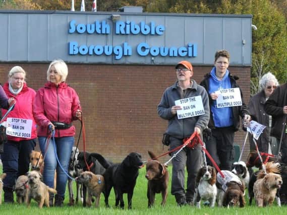 Dog walkers and dog owners protest against the council's decision