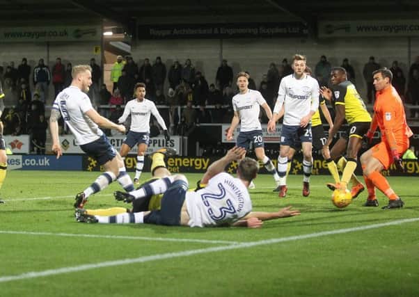 Preston North End's Tom Clarke scores his side's first goal
