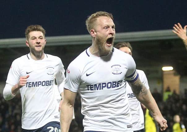 Tom Clarke celebrates scoring against Burton Albion