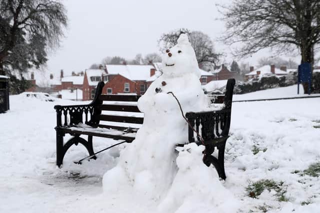 A snowman on a bench Worcester. Photo: David Davies/PA Wire