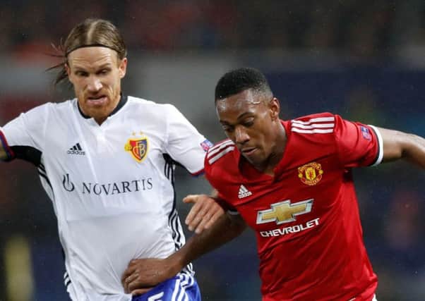 Basel's Michael Lang (left) and Manchester United's Anthony Martial in the Champions League group match at Old Trafford in September  the Swiss side now face Manchester City