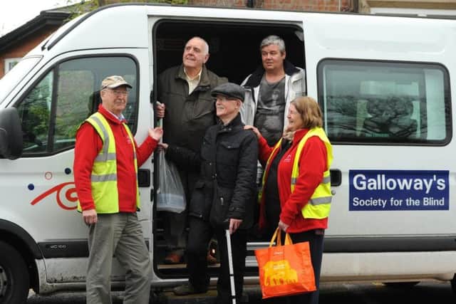 Volunteer driver Norman Worthington with his assistant Cheryl Lynes and clients David Hughes, Joe Etherington and Gary Dawson at Galloway's Society for the Blind