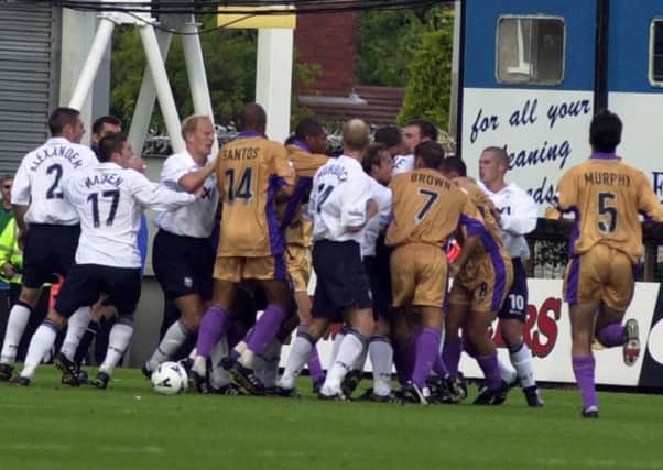 PNE and Sheffield United players wade into a skirmish after Paul Devlin's tackle on Paul McKenna leads to a red card
