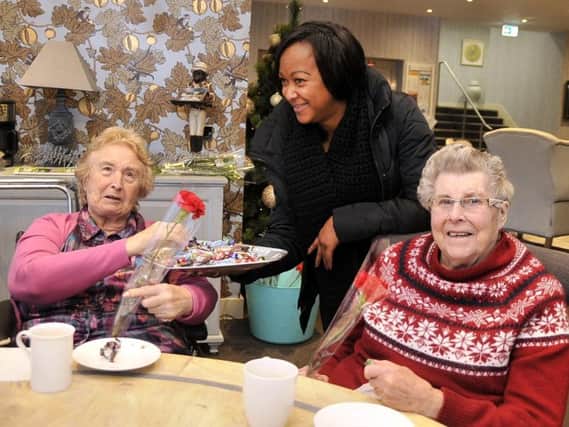 Finney House residents Jean Fell (left) and Mary Jackson (right) with Light Foundation volunteer Yvonne Fontaine. Photo: Kevin McGuinness.