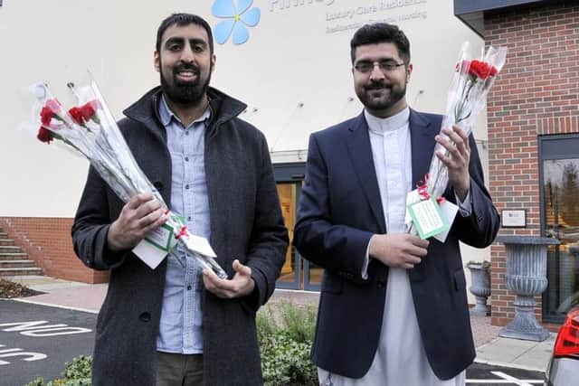 Arfan Iqbal (left) and Nadeem Ashfaq of the Light Foundation took gifts to the residents of Finney House in Deepdale. Photo: Kevin McGuinness