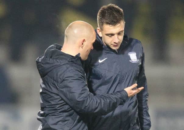 Preston North End manager Alex Neil talks to Jordan Hugill